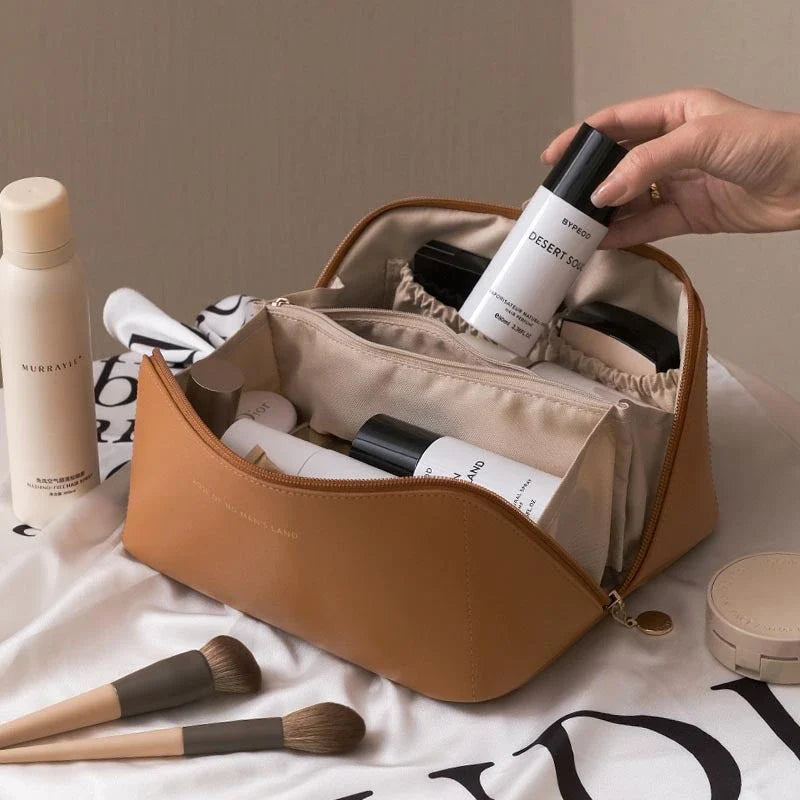 Premium PU leather cosmetic bag with large capacity, versatile storage, and water-resistant design for modern women on the go
