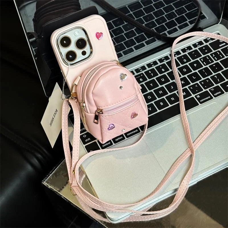 Crossbody Wallet Phone Case for ApplePhone in white, black, and pink with removable strap