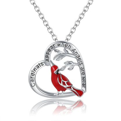 Elegant heart-shaped cardinal pendant necklace with a silver finish, perfect for gifting.