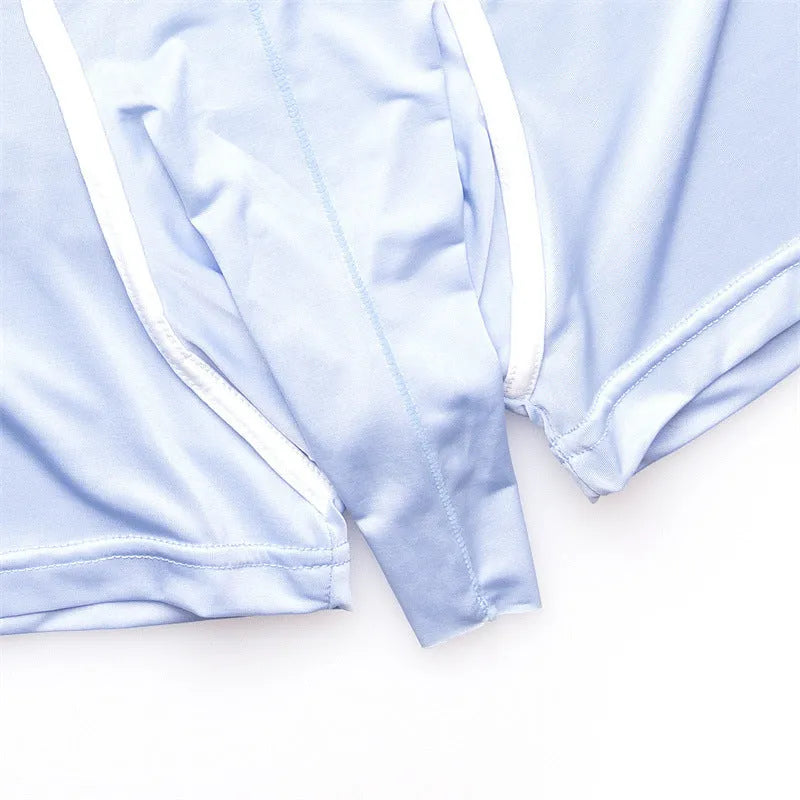 Men's solid colour Ice Silk boxers in black, shown laid flat, with a mid waist design.