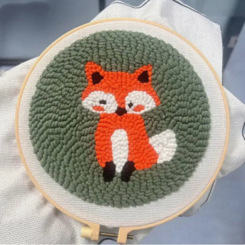 Beginner embroidery craft suit showing six cartoon designs including turtle, sheep, horse, fox, butterfly, and mermaid patterns