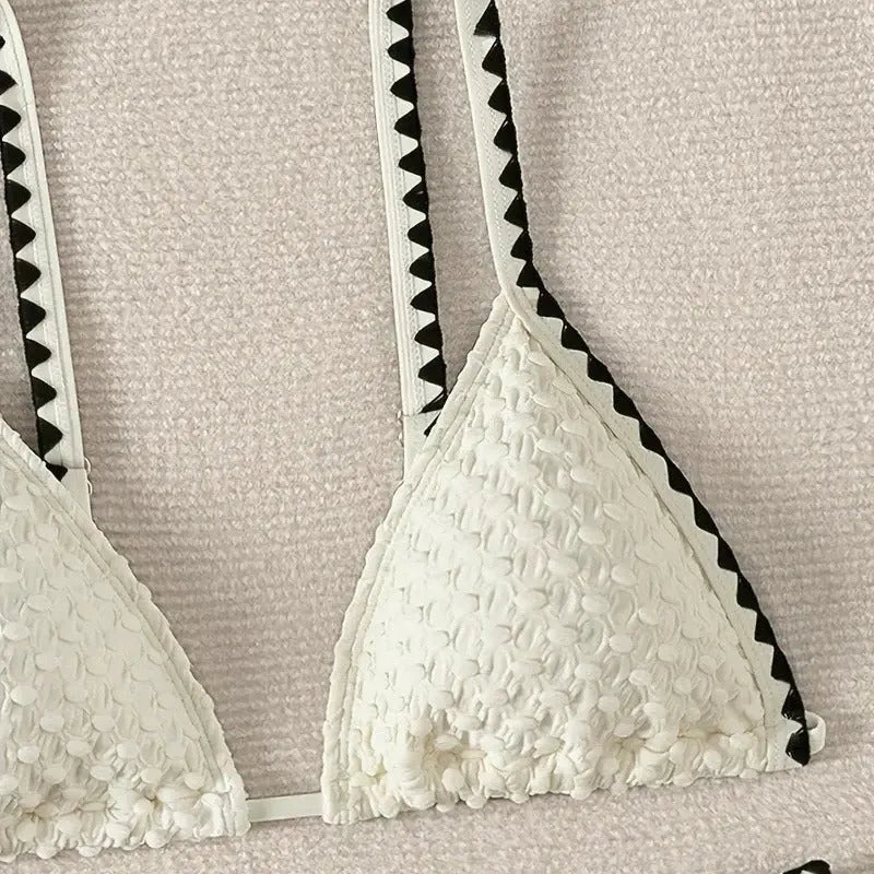 Women's blue or white two-piece bikini swimsuit with briefs style.
