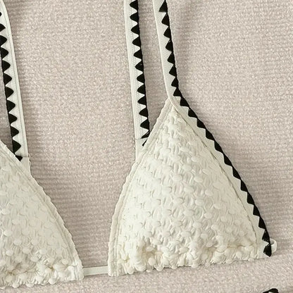 Women's blue or white two-piece bikini swimsuit with briefs style.