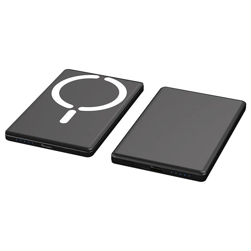 Slim dark grey magnetic power bank attached to the back of an iPhone, showing its thin profile and metallic finish.