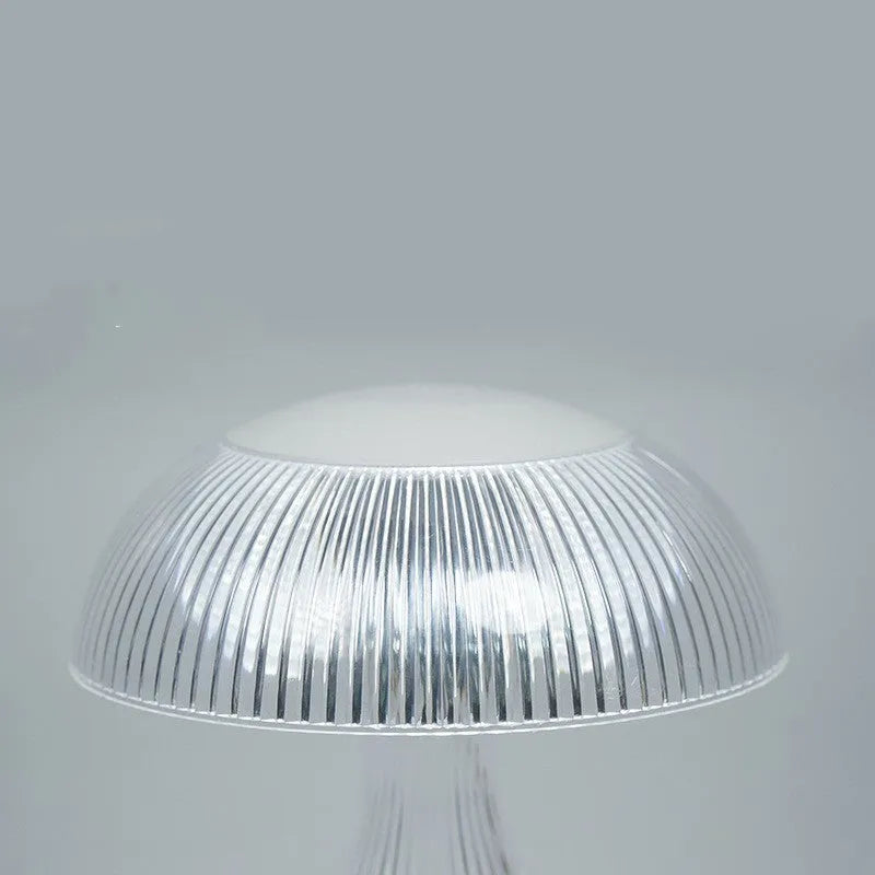 Small white acrylic USB rechargeable table lamp with a three-colour LED light.