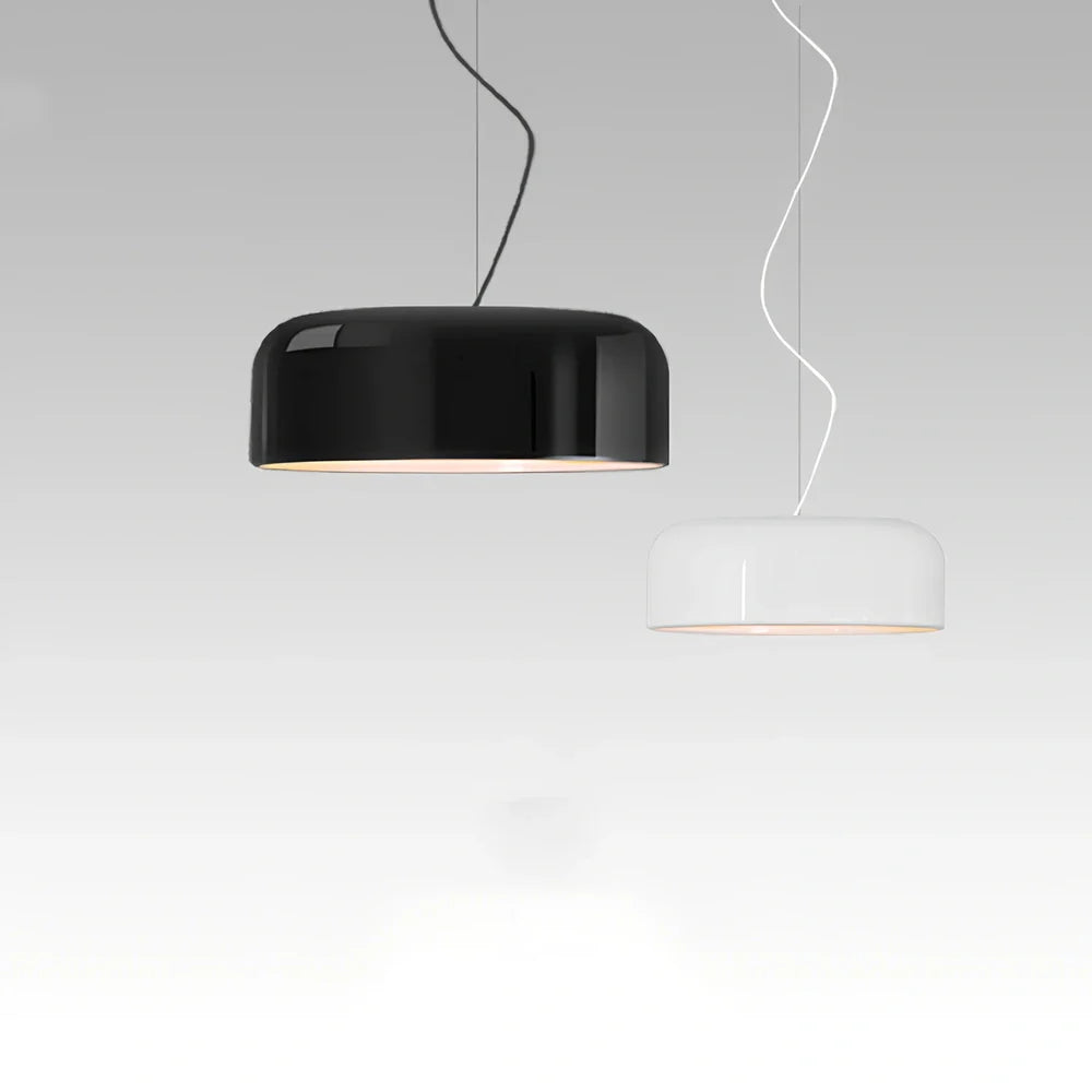 Scandinavian 35cm linear glass chandelier in black aluminium with warm light over dining table