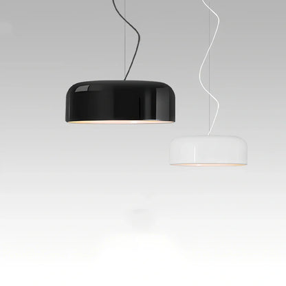 Scandinavian 35cm linear glass chandelier in black aluminium with warm light over dining table