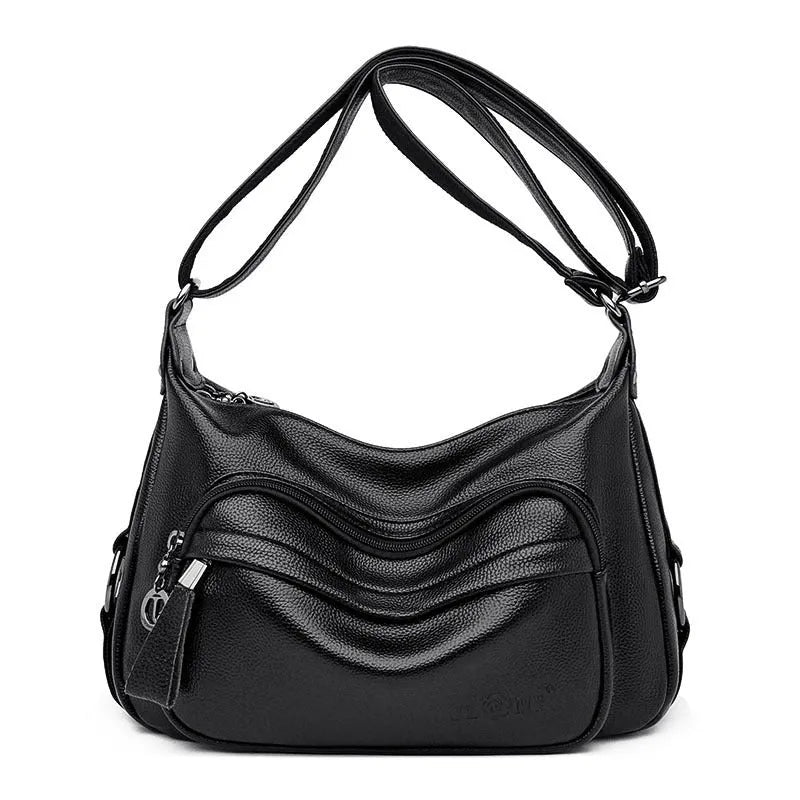 Large blue women's shoulder bag with crossbody strap and multiple internal compartments