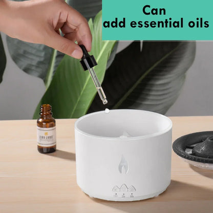 Black columnar ultrasonic humidifier with volcano flame effect and jellyfish smoke rings emerging from mist