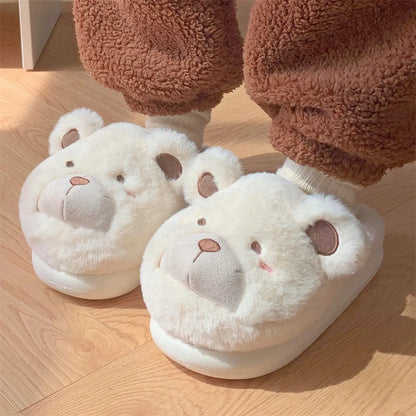 Women's cartoon-patterned suede plush slippers in milky white, shown with a rounded toe.