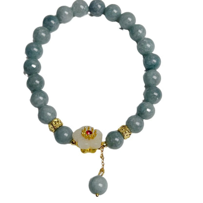 Women's adjustable jade bracelet with rope fastening showing retro styling and optimised jade colour