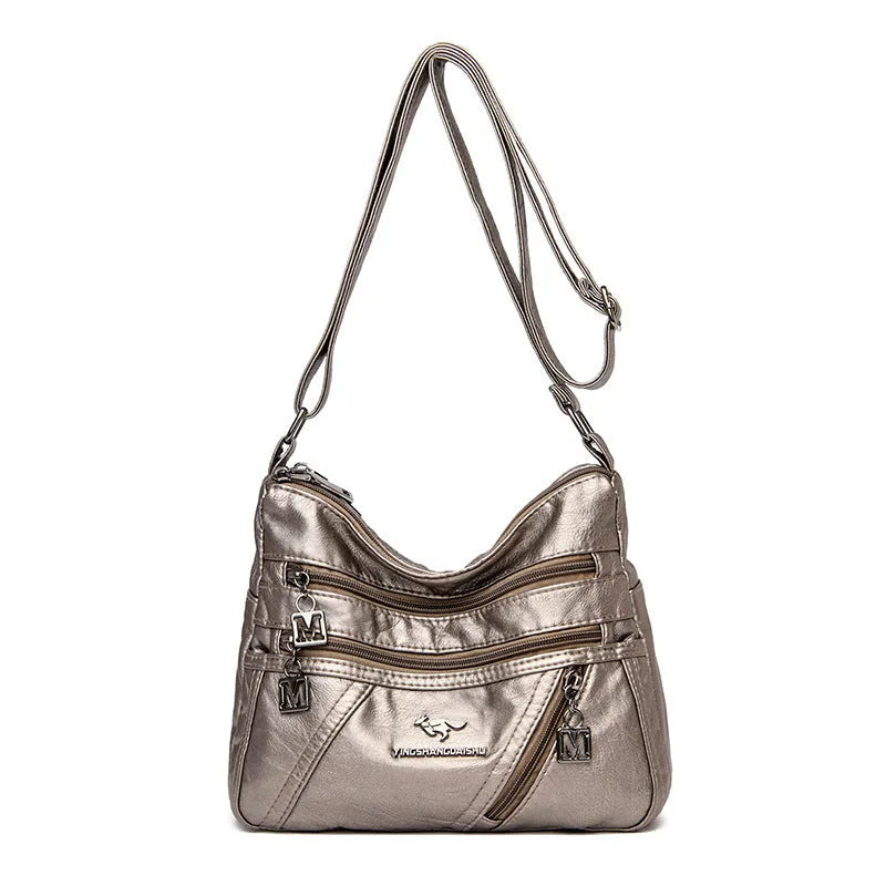 Middle-aged women's double layer PU shoulder bag with large capacity, welt pocket, and soft build in red, purple, dark blue, black, bronze, gray, or tan.