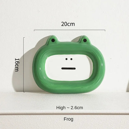 Four ceramic animal-themed pet bowls with frog, panda, pig, and fortune cat designs and silicone non-slip bases