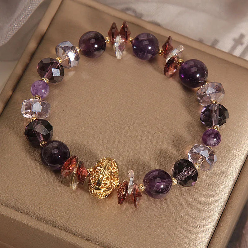Purple crystal bracelet with pumpkin beads and rhinestone decoration
