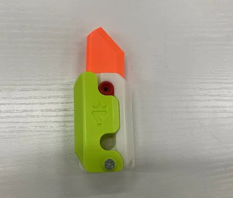 3D printed plastic carrot fidget knife with retractable blade, shown in orange and green colour scheme.