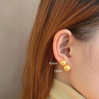 Geometric eight-point star pearl stud earrings in silver with cultured pearls, showing post-and-clasp fastening