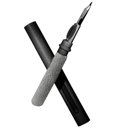 Black and white plastic earbud cleaning pen with a brush for headphones and mobile phones