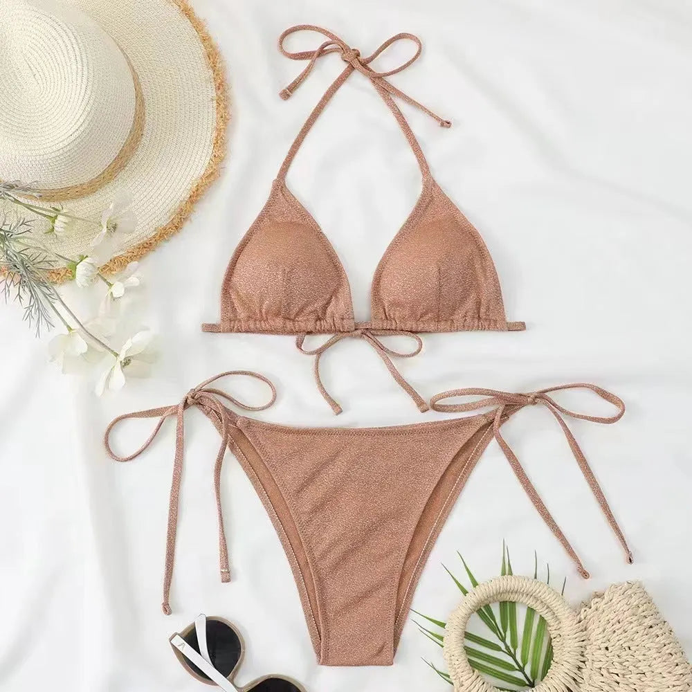 Women's khaki gold bandage bikini with adjustable straps on a beach background