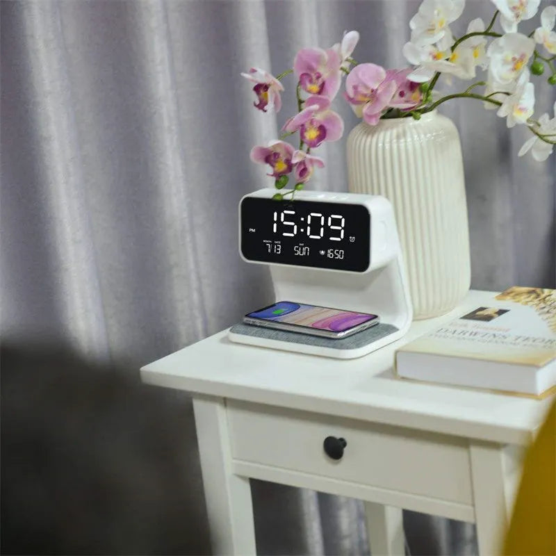 White 3-in-1 bedside lamp with wireless charging pad, LCD alarm clock screen, and touch controls.