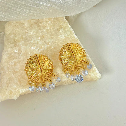 Gold geometric circle drop earrings with electroplated metal construction