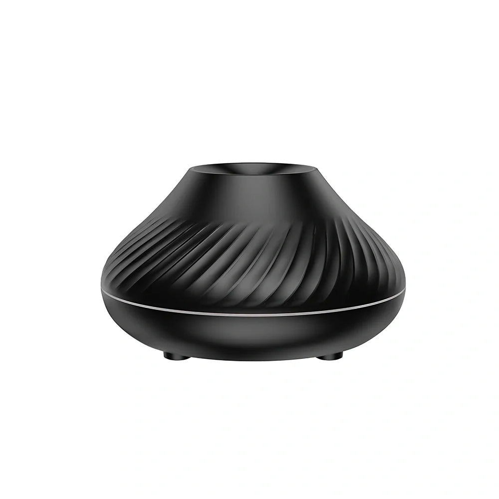 Black RGB flame aroma diffuser 130ml showing 3D colourful volcano mist effect on table