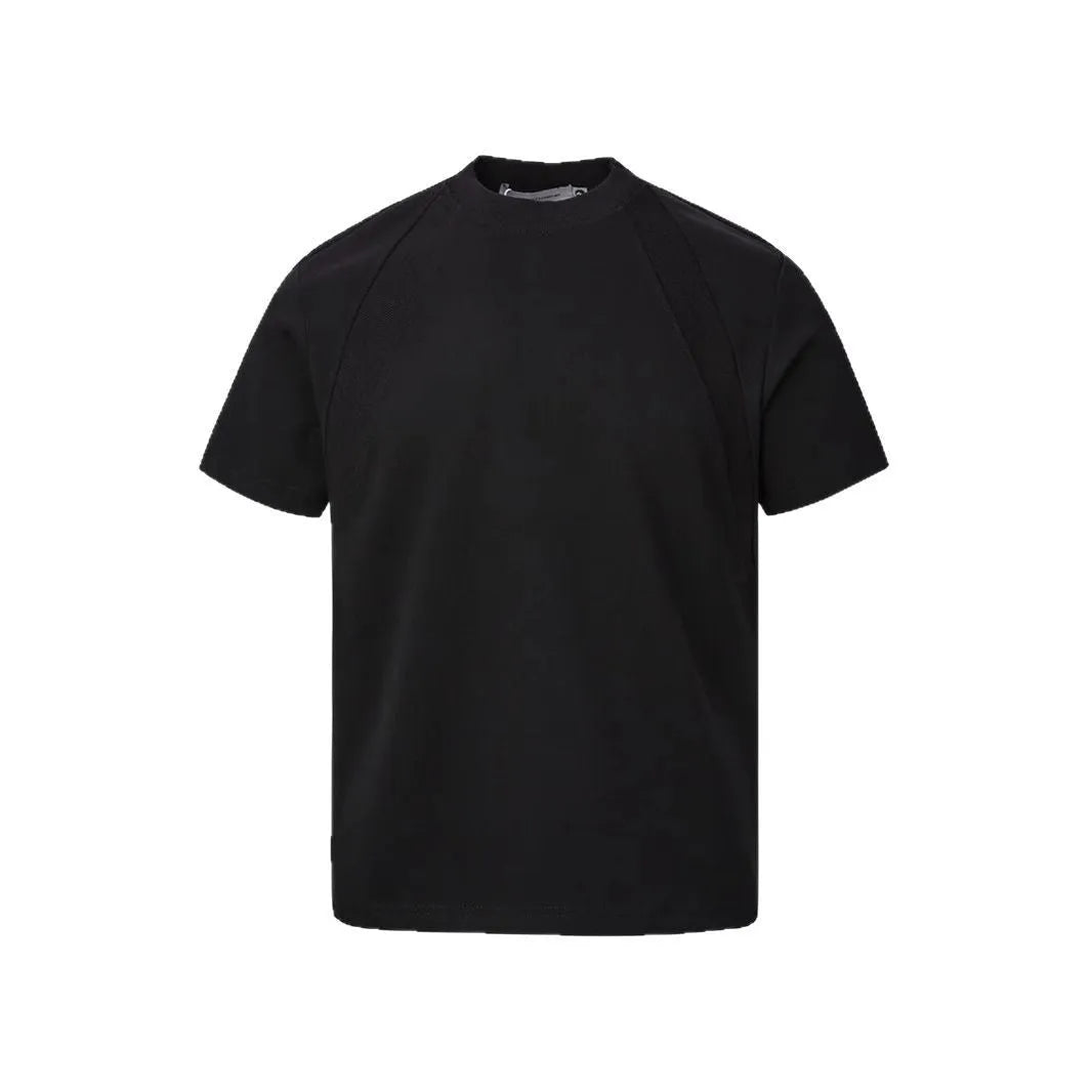 Loose-fit black short sleeve top with textured air layer stitching on a mannequin.