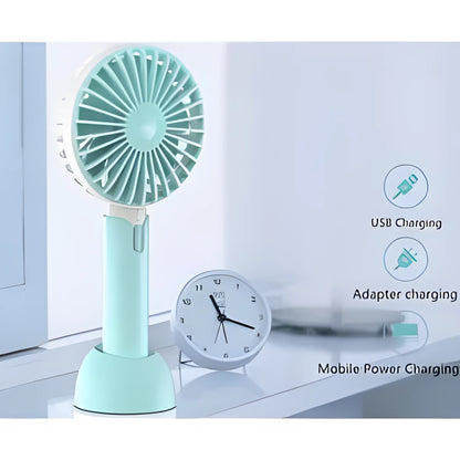 Blue handheld and desktop mini USB electric fan with three-speed control on a table.