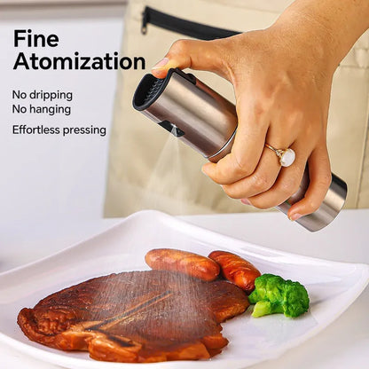 Glass oil spray bottle with stainless steel press cap showing 100ml capacity
