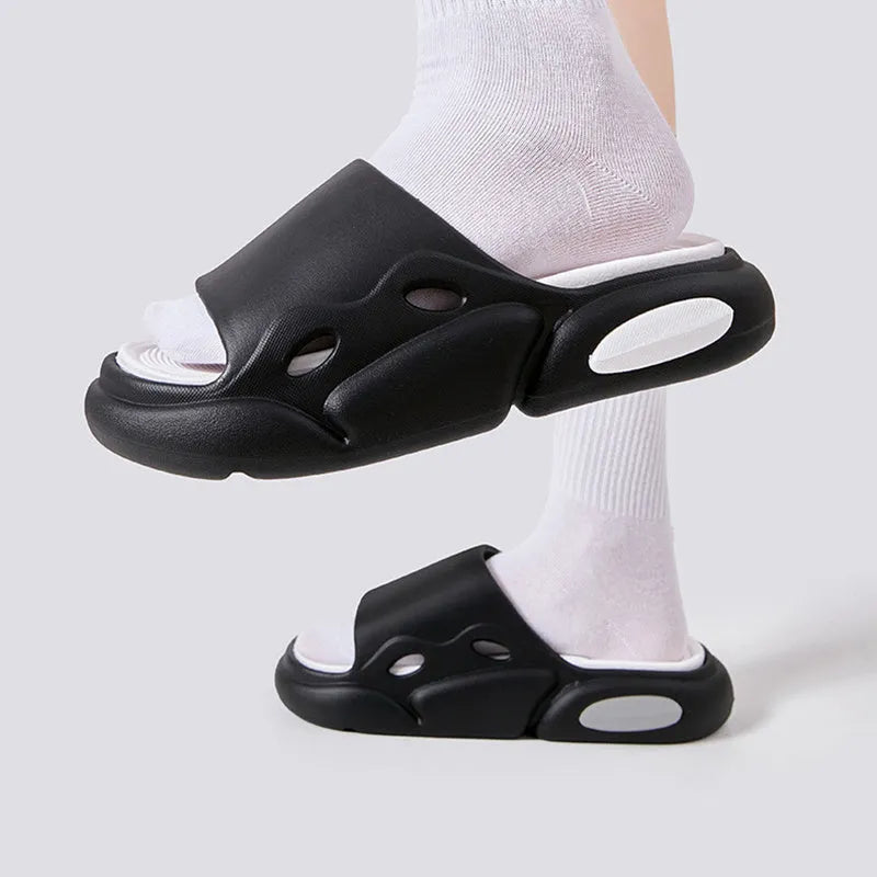 Pair of two-tone thick-soled EVA slippers with a leather lining, shown in pink and purple.