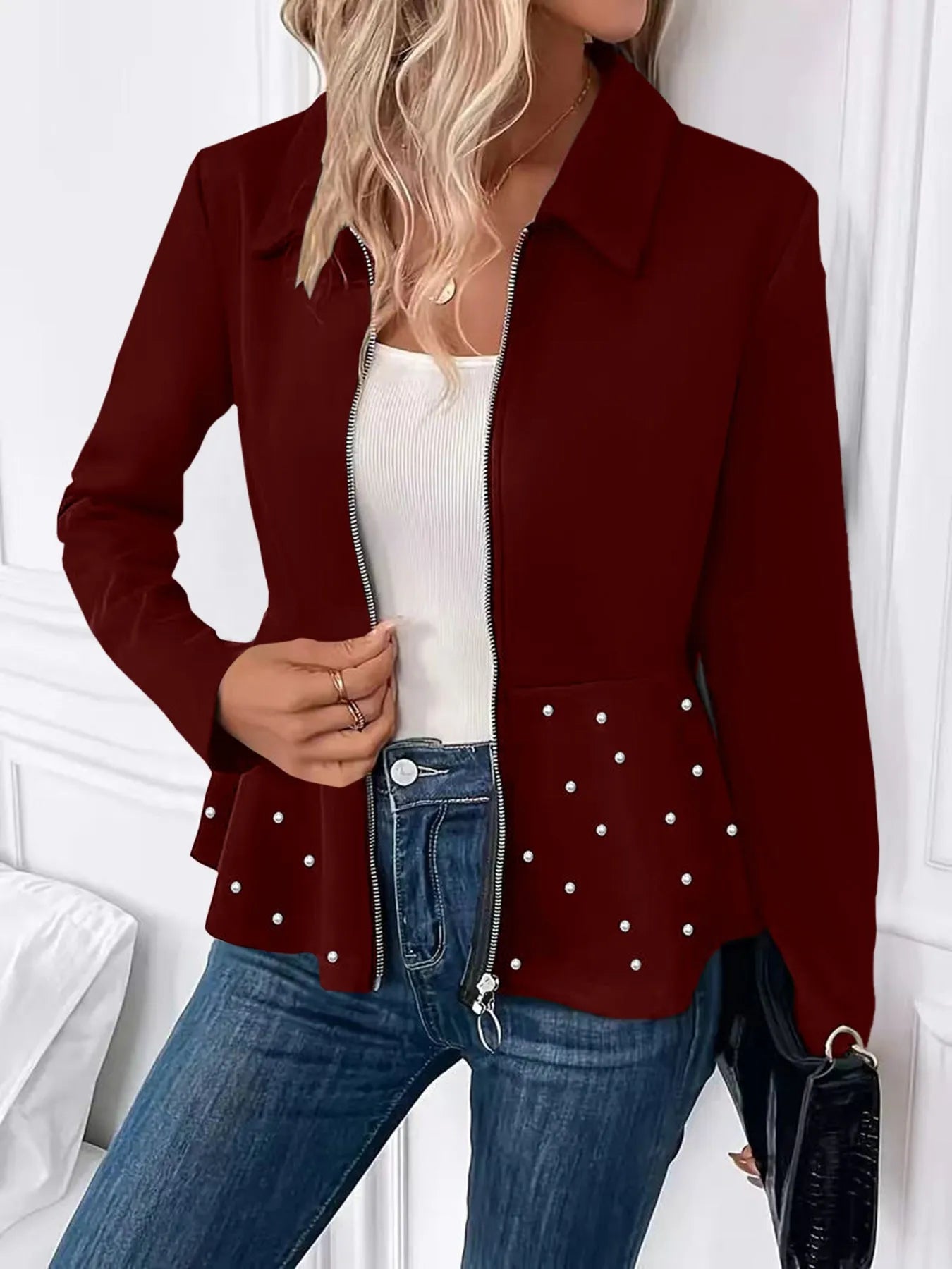 Women's black coat with beaded heavy-duty zipper and ruffled hem detail