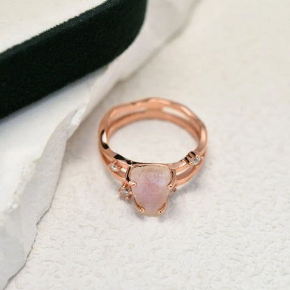 S925 sterling silver ring with an irregular triangular bezel holding a genuine cabochon moonstone, on a model's finger.