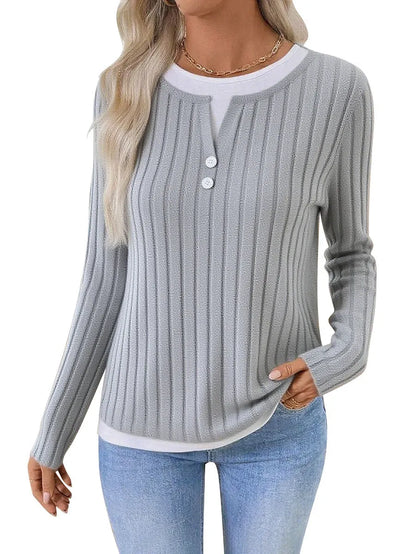 Women's black fake two-piece pullover sweater with concave stripe texture and round neck.