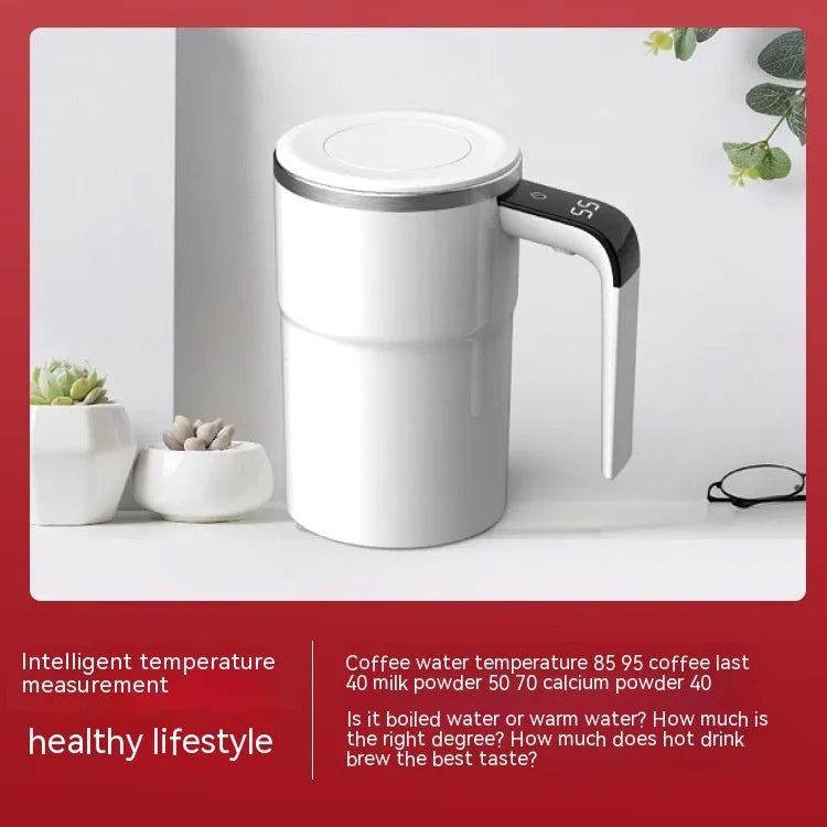 Electric coffee mug with USB charging port, magnetic stirrer, and LCD display showing temperature, in black or white colour.