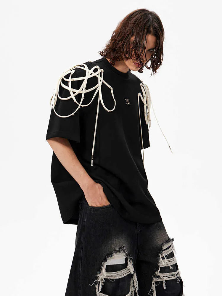 Black loose fit short sleeve T-shirt with rivet ribbon padded shoulder detail and round neck
