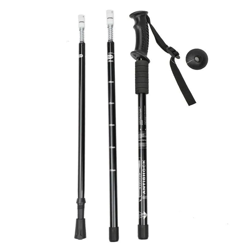 Aluminium alloy telescopic trekking pole extended with three straight handles and accessory attachments