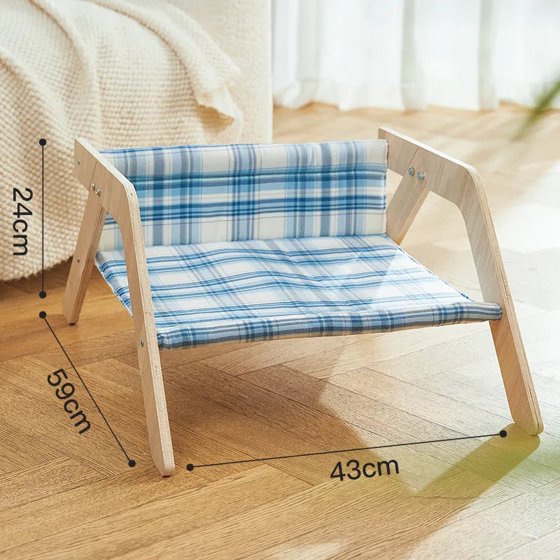 Elevated wooden cat beach chair bed with cloth lounging surface in blue or green.