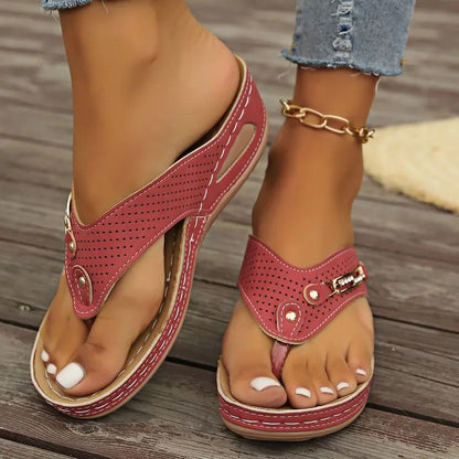Retro-style women's flip-flop sandals in light brown with a herringbone footbed pattern.
