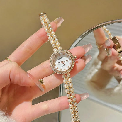 Women's vintage freshwater pearl bracelet watch with 25mm dial, steel strap, and double row pearl design in silver