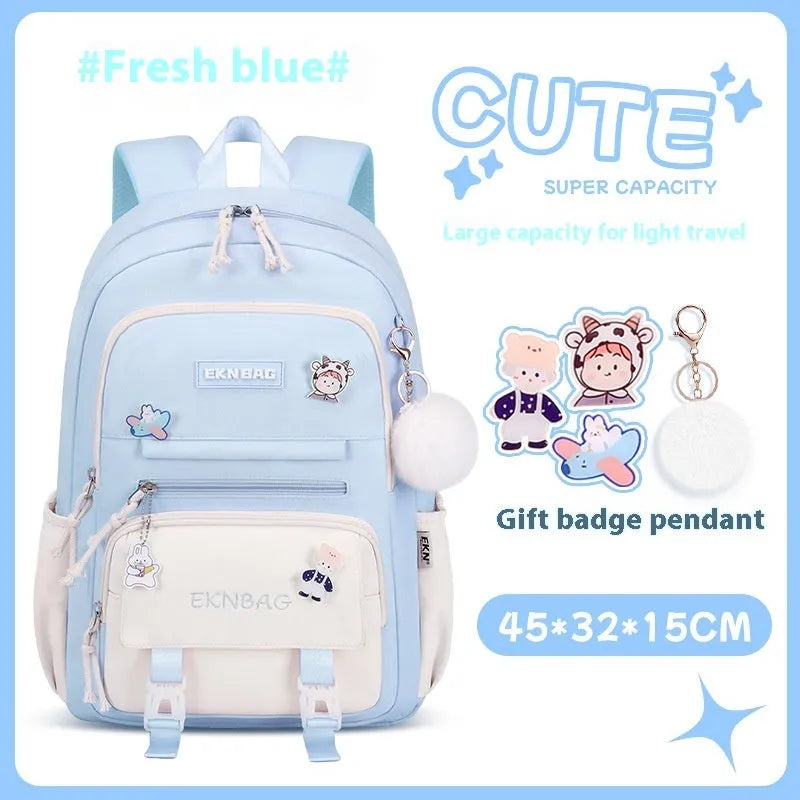 Pink girls school backpack with curved shoulder straps on a wooden floor