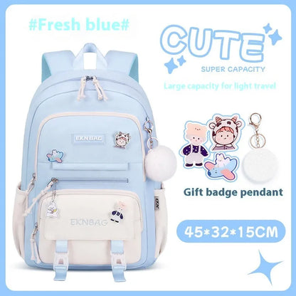 Pink girls school backpack with curved shoulder straps on a wooden floor