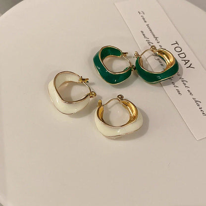 Stylish geometric earrings with dripping glaze in candy colours, perfect for adding a modern touch to any outfit.