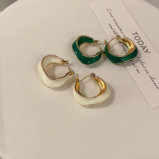 Stylish geometric earrings with dripping glaze in candy colours, perfect for adding a modern touch to any outfit.
