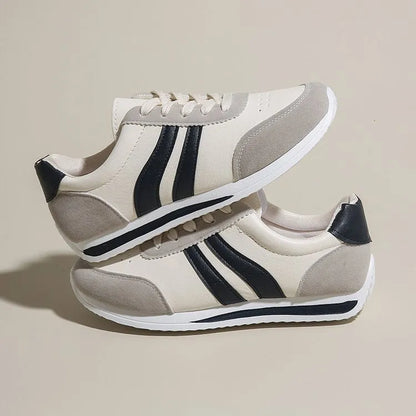 Blue and red low-top lace-up sneaker with soft rubber soles and mesh lining