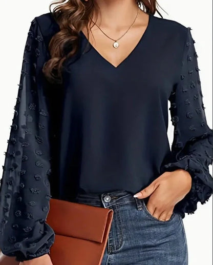 A soft, breathable polyester shirt with a delicate Swiss dot pattern, perfect for casual spring and autumn wear.