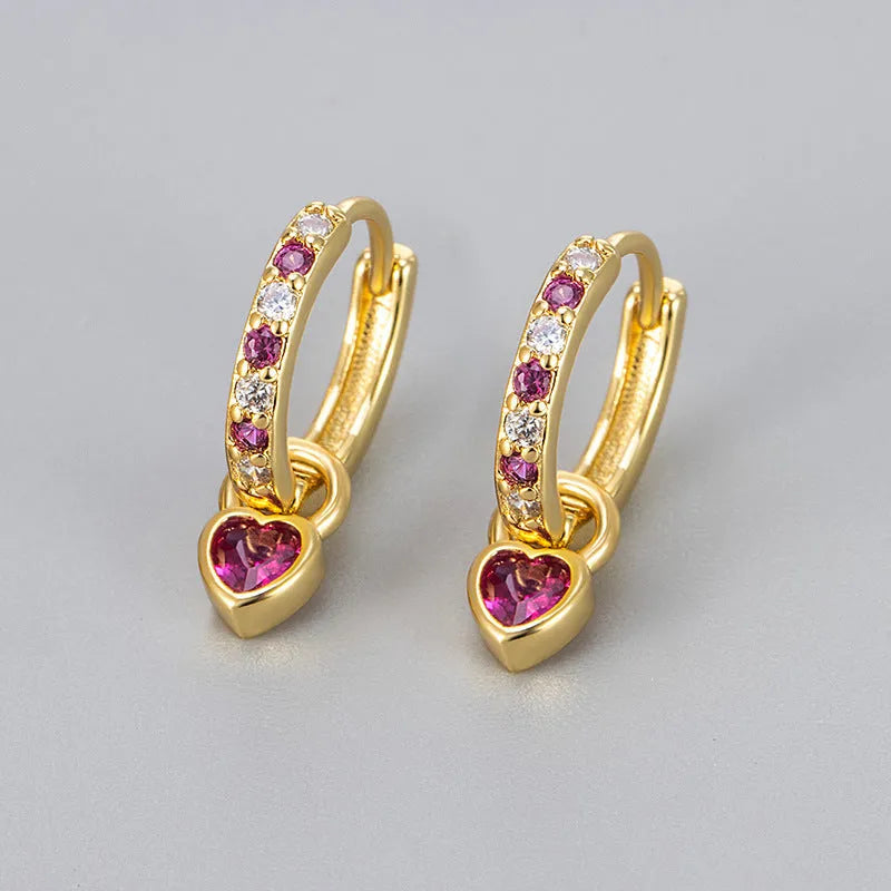 Women's fashion earrings with heart-shaped eardrops, diamond-treated gemstones in gold or white gold plating, approximately 2.5 cm long