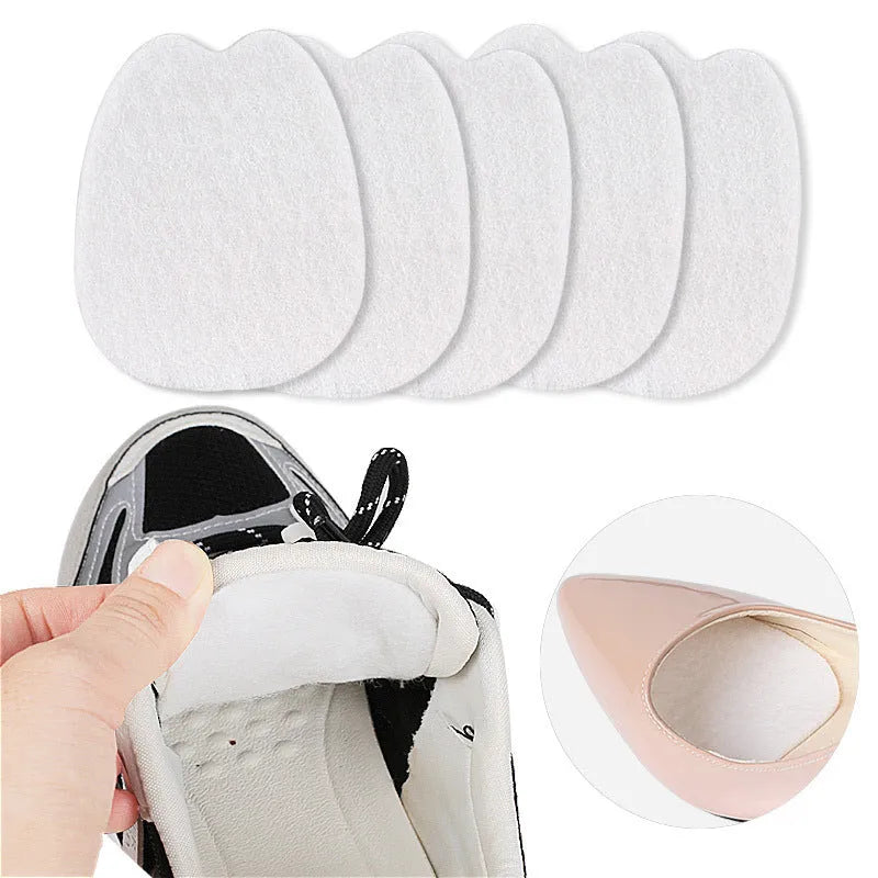 White thin felt anti-wear shoe tongue stickers showing front pad design for friction prevention