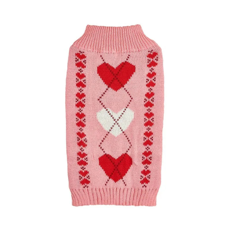 Dog wearing red love heart design sweater with bow decoration