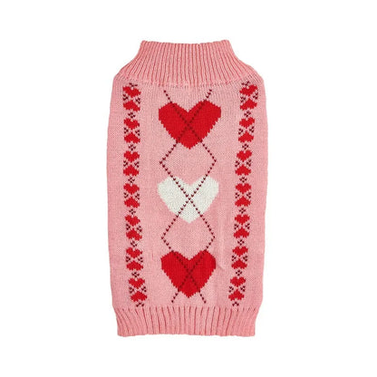 Dog wearing red love heart design sweater with bow decoration