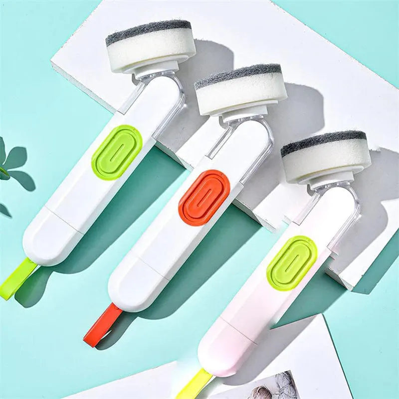 White and red long-handle kitchen brush with soap dispenser button and two interchangeable scrub heads on a hook.