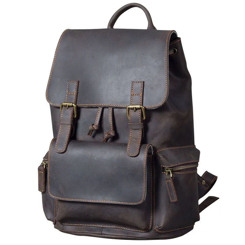 Retro brown genuine cowhide leather backpack with shoulder straps and a top handle.